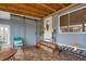 Inviting covered patio featuring tile floor and a sliding barn door for flexible indoor-outdoor living at 970 Jolanda Cir, Venice, FL 34285