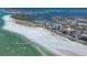 Beautiful aerial shot features the beachfront property, offering stunning views of the coastline and surrounding areas at 101 Benjamin Franklin Dr # 71, Sarasota, FL 34236