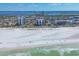 Breathtaking aerial view of the white sand beach with waterfront condos and the city skyline in the background at 101 Benjamin Franklin Dr # 71, Sarasota, FL 34236