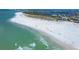 An aerial view shows the beautiful beaches surrounding the property, with crystal blue water and clear white sand at 101 Benjamin Franklin Dr # 71, Sarasota, FL 34236