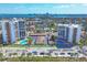 Aerial view of twin high-rise condominium buildings with community pools and beach access at 101 Benjamin Franklin Dr # 71, Sarasota, FL 34236