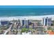 Beautiful aerial view of oceanfront condos along white sand beaches near luxury real estate and tranquil blue ocean at 101 Benjamin Franklin Dr # 71, Sarasota, FL 34236