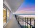 Expansive balcony overlooking the beach offers panoramic views and a tranquil outdoor living space at 101 Benjamin Franklin Dr # 71, Sarasota, FL 34236