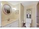 Bathroom featuring a vanity with granite counters, a toilet, and a glass shower enclosure at 101 Benjamin Franklin Dr # 71, Sarasota, FL 34236