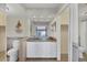 Clean bathroom with updated vanity, granite countertops, and ample lighting at 101 Benjamin Franklin Dr # 71, Sarasota, FL 34236
