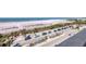 A scenic beach view showcasing palm trees, parking, and the ocean at 101 Benjamin Franklin Dr # 71, Sarasota, FL 34236