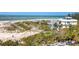 View of a beach and luxury home at 101 Benjamin Franklin Dr # 71, Sarasota, FL 34236