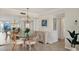 Formal dining room with chandelier, mirror and water view at 101 Benjamin Franklin Dr # 71, Sarasota, FL 34236