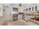 Updated kitchen features stainless steel appliances, granite counters, and tiled floor at 101 Benjamin Franklin Dr # 71, Sarasota, FL 34236