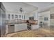 Bright kitchen with stainless steel appliances, granite counters and a breakfast bar at 101 Benjamin Franklin Dr # 71, Sarasota, FL 34236