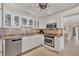 Bright kitchen with stainless appliances, granite counters, and eating area at 101 Benjamin Franklin Dr # 71, Sarasota, FL 34236