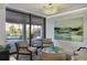 Well appointed living room with art and a view of the outdoor pool at 101 Benjamin Franklin Dr # 71, Sarasota, FL 34236