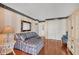 Living room with hardwood floors, a comfortable couch, and ample closet space at 101 Benjamin Franklin Dr # 71, Sarasota, FL 34236