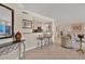 Open-concept living area with stylish bar stools and elegant decor flows seamlessly into other living spaces at 101 Benjamin Franklin Dr # 71, Sarasota, FL 34236