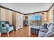 Cozy living room with hardwood floors, a comfortable couch, and a beautiful ocean view at 101 Benjamin Franklin Dr # 71, Sarasota, FL 34236