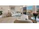 Cozy living room featuring tile floors, comfortable seating, and a lovely ocean view at 101 Benjamin Franklin Dr # 71, Sarasota, FL 34236