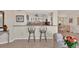 Stylish living area with bar seating provides a view to the kitchen and dining room at 101 Benjamin Franklin Dr # 71, Sarasota, FL 34236