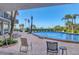 Beautiful outdoor pool area with lounge chairs and tropical landscaping at 101 Benjamin Franklin Dr # 71, Sarasota, FL 34236