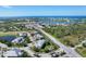 Stunning aerial view of coastal community with lush landscaping and beautiful water views at 10600 Lemon Creek Loop # 102, Englewood, FL 34224