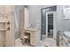 Bathroom featuring vanity, shower, and a built-in cabinet for storage at 10600 Lemon Creek Loop # 102, Englewood, FL 34224