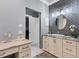 Bathroom with vanity, decorative wall and granite countertop at 10600 Lemon Creek Loop # 102, Englewood, FL 34224