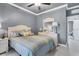Comfortable bedroom with a neutral color palette, ceiling fan and a cozy ambiance at 10600 Lemon Creek Loop # 102, Englewood, FL 34224
