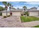 Townhomes featuring brick driveways, lush landscaping, and attached garages for convenient parking at 10600 Lemon Creek Loop # 102, Englewood, FL 34224