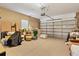 Spacious two-car garage featuring ample storage space for tools and equipment at 10600 Lemon Creek Loop # 102, Englewood, FL 34224