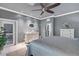 Comfortable and cozy main bedroom with a dresser, white accents, and sliding doors at 10600 Lemon Creek Loop # 102, Englewood, FL 34224