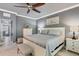 Spacious main bedroom with a view to the ensuite bath, neutral colors and bright natural light at 10600 Lemon Creek Loop # 102, Englewood, FL 34224