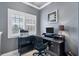 Comfortable office space with ample natural light, functional desk setup, and modern fixtures at 10600 Lemon Creek Loop # 102, Englewood, FL 34224