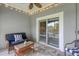 Relaxing screened porch featuring comfortable furniture, string lights, and a peaceful outdoor view at 10600 Lemon Creek Loop # 102, Englewood, FL 34224