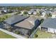 An aerial view displays the private backyard with a screened-in lanai, perfect for entertaining at 10919 Blue Magnolia Ln, Parrish, FL 34219