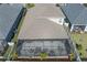 Overhead aerial view of the home's screened-in lanai and fenced-in backyard at 10919 Blue Magnolia Ln, Parrish, FL 34219
