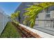 Well-manicured backyard features lush green grass and a screened-in patio for relaxing at 10919 Blue Magnolia Ln, Parrish, FL 34219