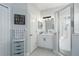 Bright bathroom featuring a glass enclosed shower, white vanity, and modern fixtures at 10919 Blue Magnolia Ln, Parrish, FL 34219