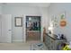 Bright bedroom with a closet, dresser, and playful dinosaur-themed decorations at 10919 Blue Magnolia Ln, Parrish, FL 34219