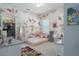 Charming bedroom with floral wallpaper, natural light, and closet at 10919 Blue Magnolia Ln, Parrish, FL 34219