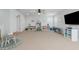 Spacious bonus room with lots of storage, toys, and an inviting play area at 10919 Blue Magnolia Ln, Parrish, FL 34219