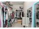 Spacious walk-in closet featuring ample shelving and hanging space for organized storage at 10919 Blue Magnolia Ln, Parrish, FL 34219