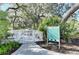 Fenced dog park with shade trees offers a secure area for residents and their guests to exercise their dogs at 10919 Blue Magnolia Ln, Parrish, FL 34219