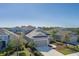 Well-maintained home exterior with a two-car garage and landscaped front yard at 10919 Blue Magnolia Ln, Parrish, FL 34219