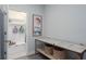 Hallway displaying an accent table, decor and a doorway with built-in storage at 10919 Blue Magnolia Ln, Parrish, FL 34219