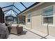 Relaxing lanai area featuring comfortable seating, perfect for outdoor entertainment and enjoying the serene surroundings at 10919 Blue Magnolia Ln, Parrish, FL 34219