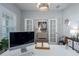 Bright office space with white furniture, a modern light fixture, and a view of the entryway at 10919 Blue Magnolia Ln, Parrish, FL 34219