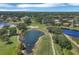 Beautiful aerial view of a golf course community with lush green fairways, water features, and well-maintained homes at 11031 Hyacinth Pl, Lakewood Ranch, FL 34202