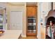 Built-in stainless steel double ovens are nested beside the pantry, in this kitchen at 11031 Hyacinth Pl, Lakewood Ranch, FL 34202