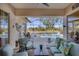 Inviting screened patio with comfortable seating overlooking pool and scenic lake view at 11031 Hyacinth Pl, Lakewood Ranch, FL 34202