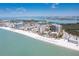 Breathtaking aerial view of beachfront condos, white sand beaches, and the sparkling Gulf coast at 1212 Benjamin Franklin Dr # 1103, Sarasota, FL 34236