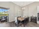 Dining area with table and chairs, plus view of the pool through sliding glass doors at 12423 Blue Hill Trl, Lakewood Ranch, FL 34211